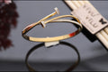 Single Golden Nail-Inspired Open Cuff Bracelet with Crystal Accent